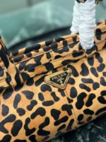 Prada Bonnie medium leopard-print pony skin leather handbag.