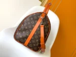 Louis Vuitton Keepall Bandoulière 50 in Monogram canvas with orange leather accents - Image 2