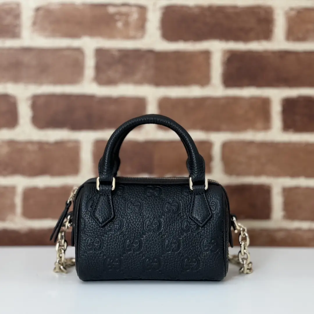 GUCCI GG Emblem medium boston bag in Black Leather